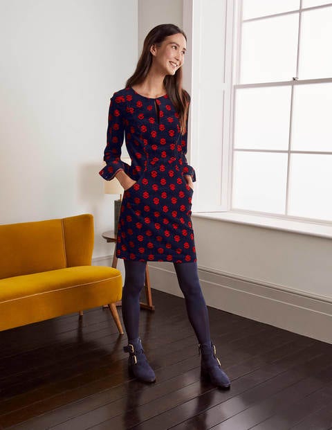 Caroline Cord-Kleid - Französisches Navy, Einfarbiges Chintz-Blumenmuster Caroline Cord-Kleid - Französisches Navy, Einfarbiges Chintz-Blumenmuster