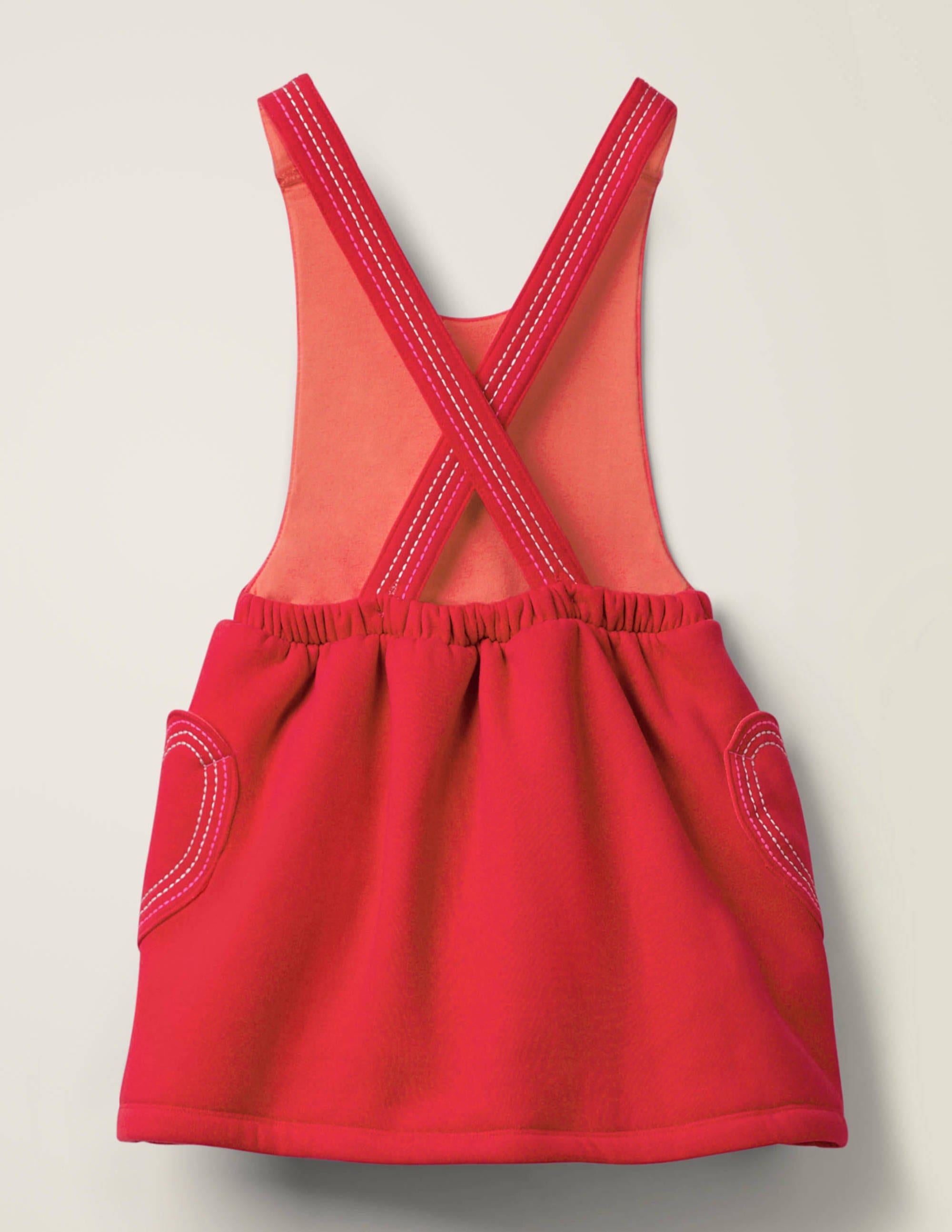 red pinafore